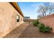 The sideyard features a rock garden with desert landscaping and privacy wall at 39 Cranberry Cove Ct, Las Vegas, NV 89135