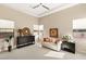 Bright sitting room boasts a sofa, natural light, and modern decor for relaxing or entertaining at 39 Cranberry Cove Ct, Las Vegas, NV 89135