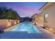 Stunning swimming pool area with serene lighting, elegant landscaping, and a private outdoor space at 39 Cranberry Cove Ct, Las Vegas, NV 89135