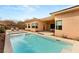 Sparkling backyard pool with sun loungers and lush landscaping, perfect for relaxation and leisure at 39 Cranberry Cove Ct, Las Vegas, NV 89135