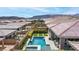 An aerial shot showcasing backyard pool, landscaping and neighborhood at 440 Point Sur Ave, Las Vegas, NV 89138