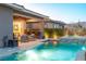 A backyard features a pool, spa, patio, and outdoor seating at 440 Point Sur Ave, Las Vegas, NV 89138