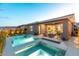 Backyard featuring a sparkling pool, spa, and patio with a seating area at 440 Point Sur Ave, Las Vegas, NV 89138