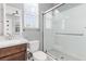 Bright bathroom featuring a glass shower, modern vanity, toilet, and neutral color palette at 440 Point Sur Ave, Las Vegas, NV 89138