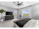 Neutral bedroom with dark wood furniture, view to backyard pool and natural light from windows at 440 Point Sur Ave, Las Vegas, NV 89138