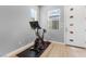 Well-lit home gym featuring exercise bikes and natural light from large window at 440 Point Sur Ave, Las Vegas, NV 89138
