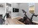 Bright exercise area with exercise bikes, a flatscreen TV and an attached bathroom at 440 Point Sur Ave, Las Vegas, NV 89138