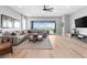 Bright living room with a comfortable sectional sofa and sliding doors to the outdoor patio at 440 Point Sur Ave, Las Vegas, NV 89138