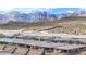 An elevated view of desert homes featuring the Red Rock mountains at 440 Point Sur Ave, Las Vegas, NV 89138