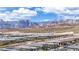 A stunning view of a neighborhood with Red Rock mountains in the background at 440 Point Sur Ave, Las Vegas, NV 89138