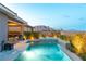 A backyard oasis features a pool, spa, and mountain views at 440 Point Sur Ave, Las Vegas, NV 89138
