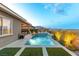 A beautiful backyard oasis with pool, spa, turf and mountain views at 440 Point Sur Ave, Las Vegas, NV 89138