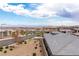 An elevated street view showcasing the desert homes and mountain views at 440 Point Sur Ave, Las Vegas, NV 89138