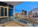 Spacious balcony featuring a stunning view of the cityscape with highways and illuminated neighboring buildings at 4575 Dean Martin Dr # 1605, Las Vegas, NV 89103