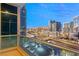 Elegant balcony with a cityscape view, highlighting neighboring buildings, traffic, and parking lots at 4575 Dean Martin Dr # 1605, Las Vegas, NV 89103