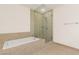 Bright bathroom featuring a separate soaking tub and glass enclosed shower with beige marble tile surround at 4575 Dean Martin Dr # 1605, Las Vegas, NV 89103