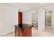 Hallway view showcasing access to bedrooms and bathrooms, with a kitchen island in the foreground at 4575 Dean Martin Dr # 1605, Las Vegas, NV 89103