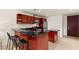 Contemporary kitchen featuring a breakfast bar with seating, stainless steel appliances, and sleek countertop finishes at 4575 Dean Martin Dr # 1605, Las Vegas, NV 89103