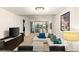Open living space featuring modern furnishings, a stylish chandelier, and large windows for natural light at 4575 Dean Martin Dr # 1605, Las Vegas, NV 89103