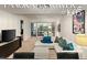 Bright living room featuring a white sofa, vibrant pillows, and a stunning city view from the large glass doors at 4575 Dean Martin Dr # 1605, Las Vegas, NV 89103