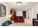 Open-concept living space with a kitchen view, featuring a stylish bar, modern art, and comfortable seating area at 4575 Dean Martin Dr # 1605, Las Vegas, NV 89103