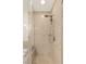 Elegant glass enclosed shower with beige marble tile surround and modern shower head at 4575 Dean Martin Dr # 1605, Las Vegas, NV 89103