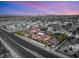 Aerial view of the property showcasing its layout, landscaping, and proximity to the city at 4775 N Tee Pee Ln, Las Vegas, NV 89129