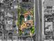 Overhead view of house, in black and white, showcasing backyard pool and tennis courts at 4775 N Tee Pee Ln, Las Vegas, NV 89129