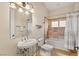 Updated bathroom with decorative tile around the bathtub and elegant fixtures at 4775 N Tee Pee Ln, Las Vegas, NV 89129