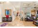 Long hallway featuring tile floors, columns, and an arched doorway at 4775 N Tee Pee Ln, Las Vegas, NV 89129
