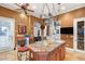 Kitchen island with sink, granite countertops, and pot rack at 4775 N Tee Pee Ln, Las Vegas, NV 89129