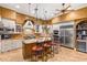 Gourmet kitchen with a large island, stainless steel appliances, and custom cabinetry at 4775 N Tee Pee Ln, Las Vegas, NV 89129