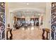 Elegant living room boasting marble floors, coffered ceilings, and custom window coverings at 4775 N Tee Pee Ln, Las Vegas, NV 89129