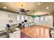 Spacious office area with hardwood floors and three ceiling fans at 4775 N Tee Pee Ln, Las Vegas, NV 89129