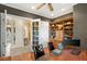 Bright office with wood floors, neutral paint, custom built-ins, and views to the entryway and other rooms at 4775 N Tee Pee Ln, Las Vegas, NV 89129