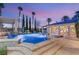 Stunning pool area with water features, a spa, and lush landscaping, perfect for relaxation at 4775 N Tee Pee Ln, Las Vegas, NV 89129