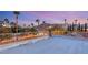 Enjoy scenic views from this rooftop featuring palm trees and a beautiful mountain backdrop at 4775 N Tee Pee Ln, Las Vegas, NV 89129