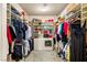 This walk-in closet has ample shelf space and storage for a large wardrobe including handbags and shoes at 4775 N Tee Pee Ln, Las Vegas, NV 89129