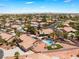 Aerial view showing a desert home with pool, manicured backyard, and a surrounding neighborhood at 5217 Cold River Ave, Las Vegas, NV 89130