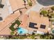 Overhead view of a desert home with solar panels, pool, fire pit, and well-maintained landscaping at 5217 Cold River Ave, Las Vegas, NV 89130