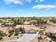 Expansive aerial view of the home with desert landscaping, two-car garage, and sparkling blue pool at 5217 Cold River Ave, Las Vegas, NV 89130