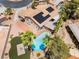 Aerial view of the property highlighting the pool, solar panels and landscaped backyard at 5217 Cold River Ave, Las Vegas, NV 89130