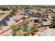 Aerial view of a residential area with desert landscaping, swimming pools, and mature trees at 5217 Cold River Ave, Las Vegas, NV 89130