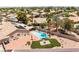 Aerial shot of a backyard featuring a sparkling blue pool, patio, and artificial turf at 5217 Cold River Ave, Las Vegas, NV 89130