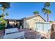 Well maintained backyard featuring a storage shed, desert landscaping, and covered patio at 5217 Cold River Ave, Las Vegas, NV 89130