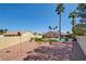 Beautiful backyard with desert landscaping, pool, and tall palm trees at 5217 Cold River Ave, Las Vegas, NV 89130