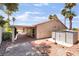 Backyard with patio area, desert landscaping, and palm trees at 5217 Cold River Ave, Las Vegas, NV 89130