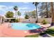 Beautiful backyard pool, mature trees, lush turf, and patio offer a private oasis for outdoor entertaining at 5217 Cold River Ave, Las Vegas, NV 89130