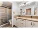 This bathroom features a double sink vanity and tiled walk-in shower at 5217 Cold River Ave, Las Vegas, NV 89130