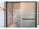 Close up of the tiled, walk-in shower with bench seat at 5217 Cold River Ave, Las Vegas, NV 89130